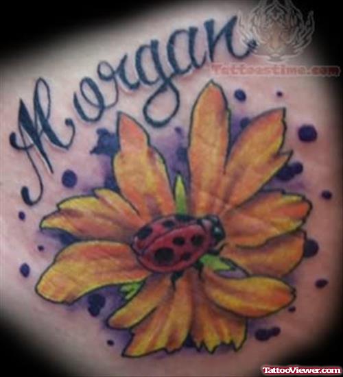 Ladybug On Flower Tattoo