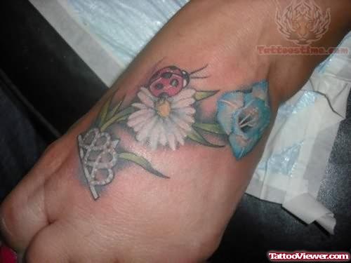 Flowers Ladybug Tattoo On Foot