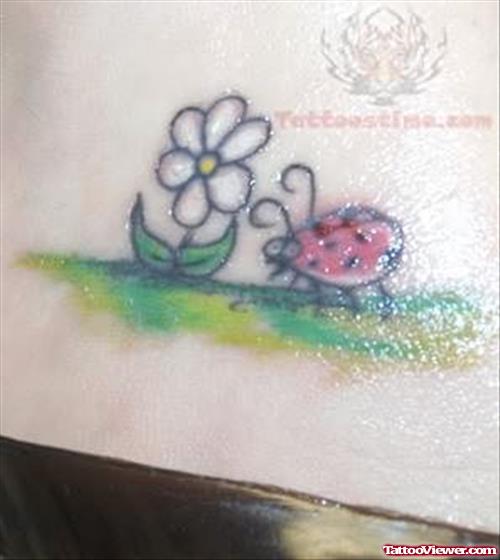 Flower And Ladybug Tattoo