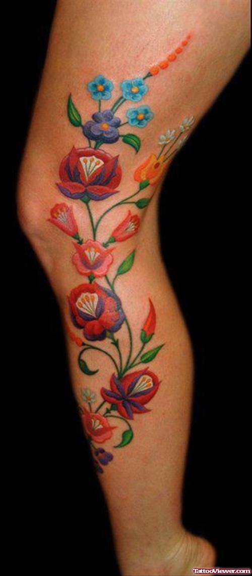 Blue and Red Flowers Leg Tattoos
