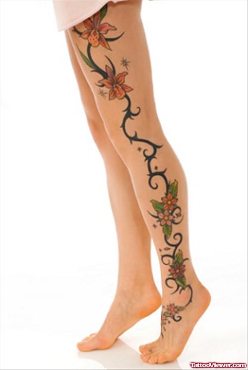 Awesome Colored Flowers Left Leg Tattoo