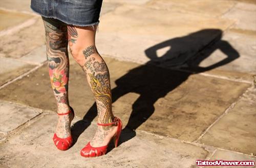 Attractive Girl With Both Leg Tattoos