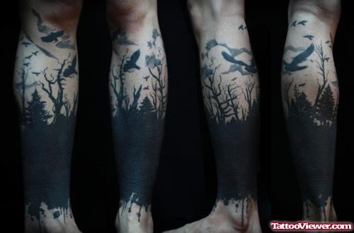 Dark Forest And Flying Bird Leg Tattoo Design