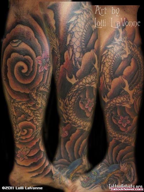 Flower And Colored Dragon Leg Tattoo