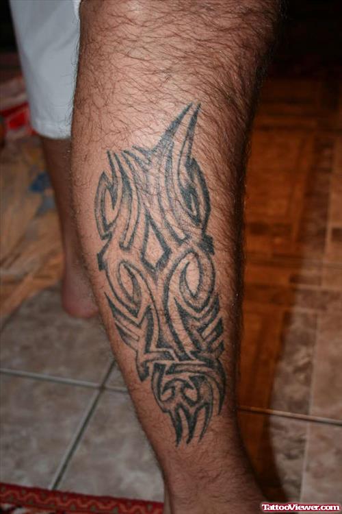 Unique Black Ink Tribal Leg Tattoo