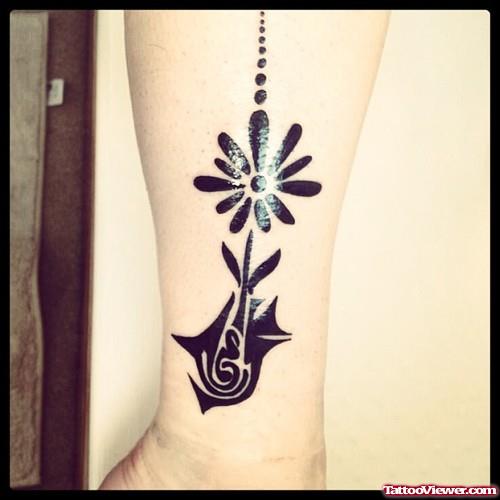 Black Ink Tribal And Flower Leg Tattoos