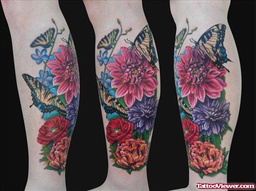 Colored Flowers And Leg Tattoo