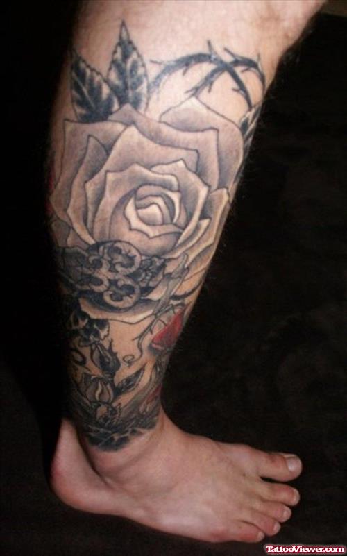 Grey Ink Rose and Skull Leg Tattoo