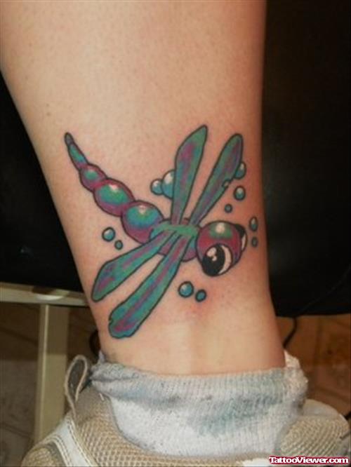 Awesome Colored Dragonfly Leg Tattoo