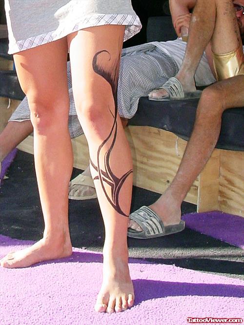 Attractive Black Ink Tribal Left Leg Tattoo