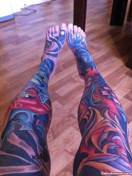 Colored Flowers And Tribal Leg Tattoo