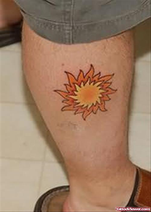 Orange Sun Tattoo On Leg
