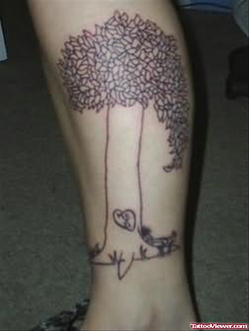 Long Tree Tattoo On Leg