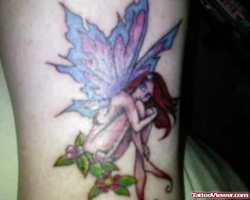 Fairy Sitting Tattoo On Leg