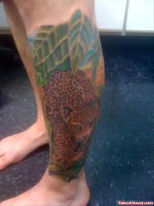 Leopard In Forest Tattoo On Leg