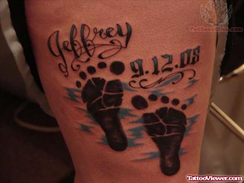 Lettering And Foot Prints Tattoo