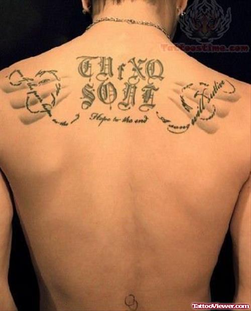 Upper Back Lettering Tattoo For Men