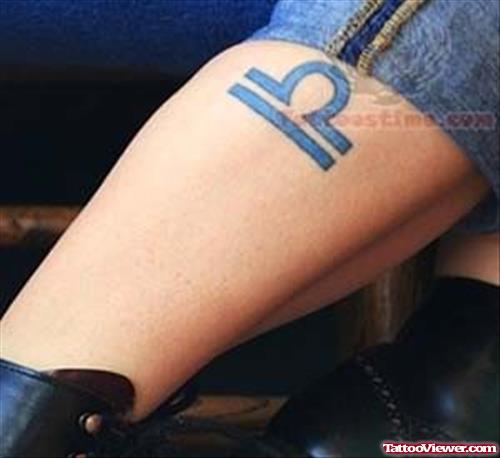 Blue Ink Libra Tattoo On Leg