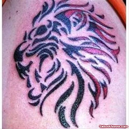 Red And Black Tribal Lion Head Tattoo