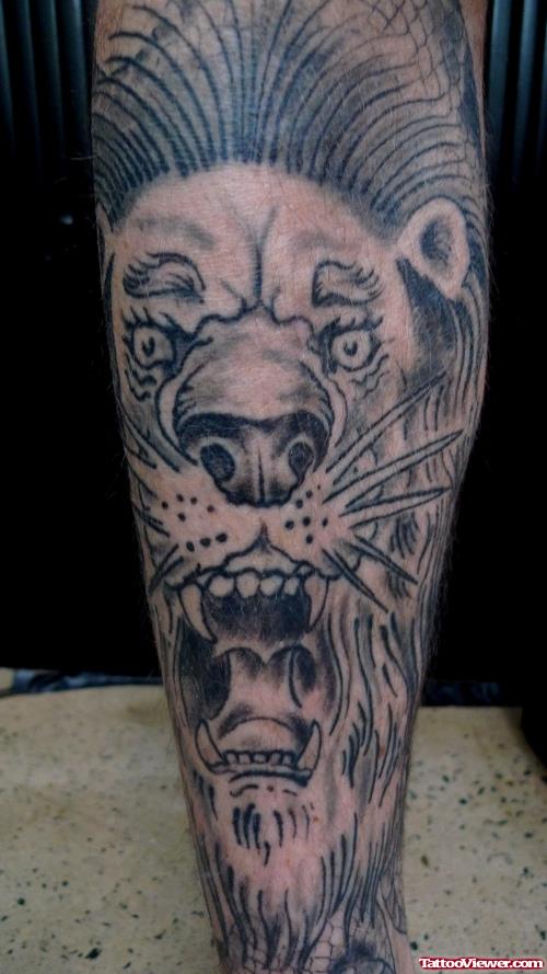 Grey Ink Lion Tattoo On Leg