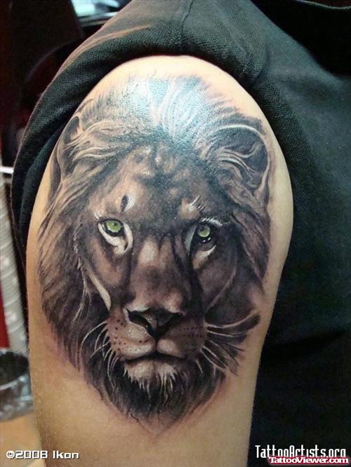 Grey Ink Lion Head Shoulder Tattoo