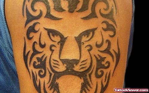 Tribal Lion Head Tattoo On Bicep
