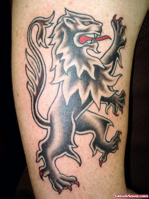 Tribal Lion With Red Tongue Tattoo