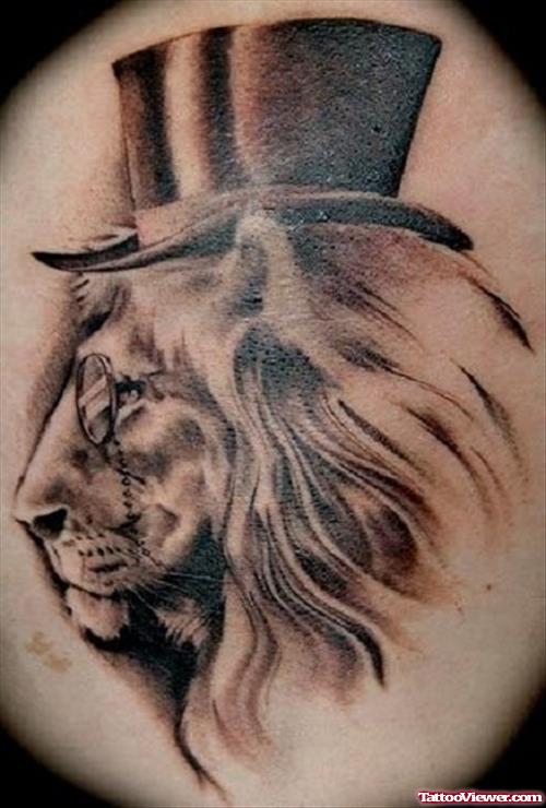 Grey Ink Lion With Hat Tattoo