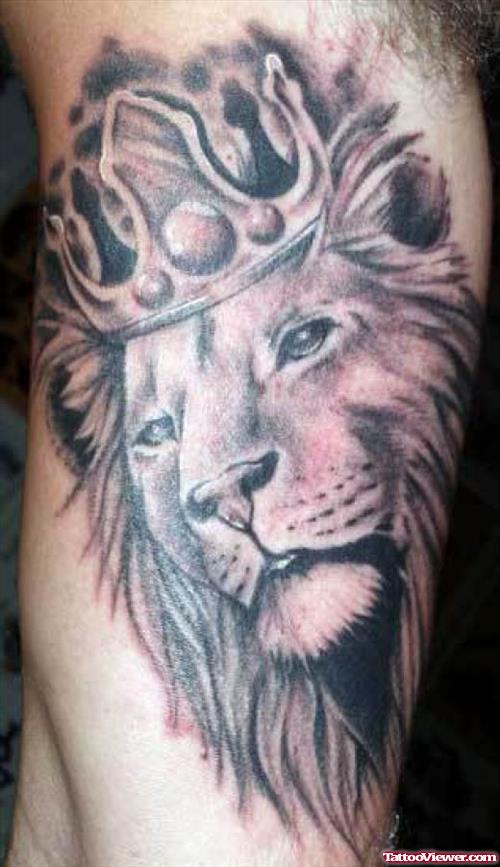 Grey Ink Crown Lion Tattoo On Bicep