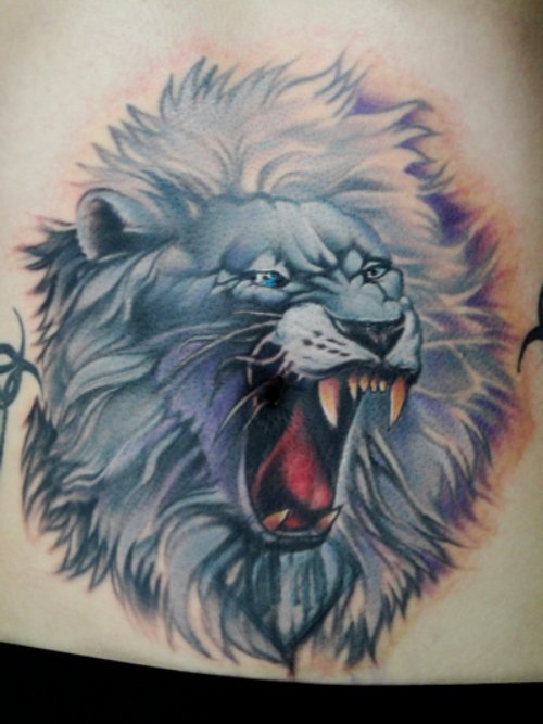 Blue Ink Angry Lion Head Tattoo On Lowerback