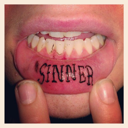 Sinner Lip Tattoo