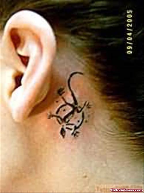 Small Lizard Tattoo Behind Ear
