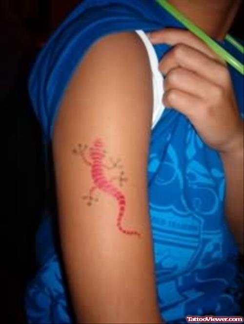 Red Lizard Tattoo On Biceps
