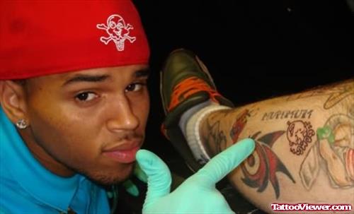 Chris Brown Lizard Tattoo