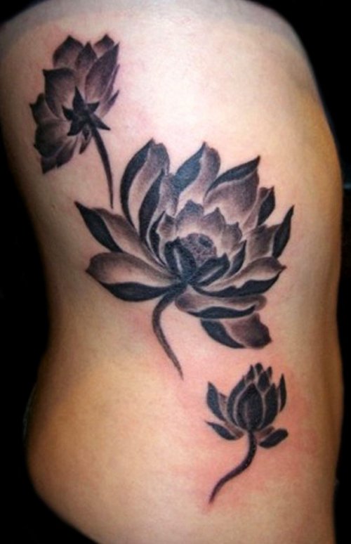 Grey And Black Lotus Flower Tattoo On Side Rib