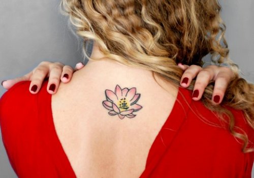 Lotus Flower Tattoo On Girl Upperback