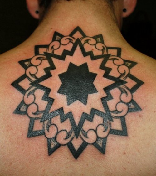 Black Ink Mandala Flower Tattoo On Back
