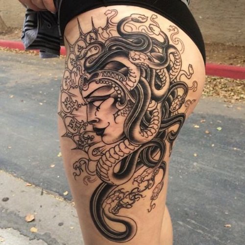 Black And Grey Medusa Girl Head Tattoo On Side Leg