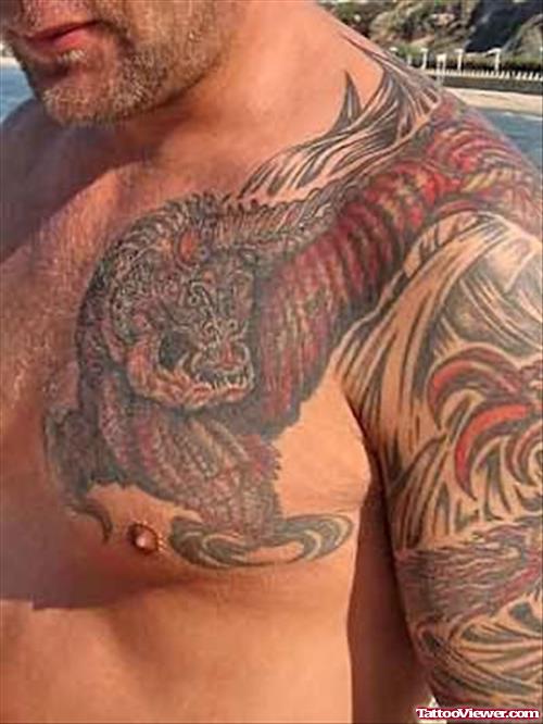 Monkey Dragon Tattoo On Chest And Arm