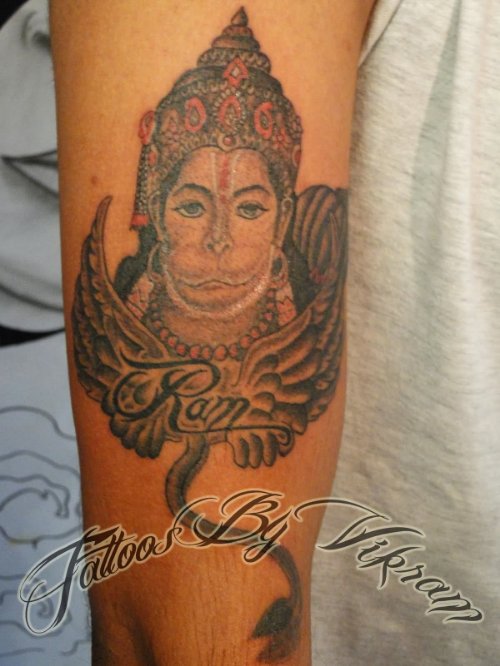 Wings And Hanuman Tattoo On Arm