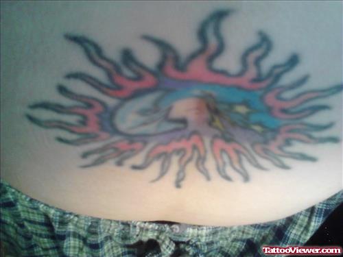 Colored Sun And Moon Tattoo On Belly