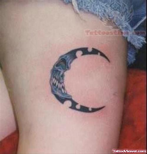 Strange Moon Tattoo On Thigh