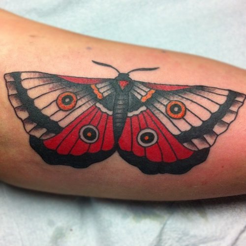 Red And Black Ink Moth Bicep Tattoo