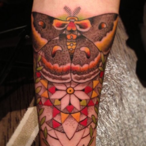 Colored Geometric and Moth Tattoo On Arm