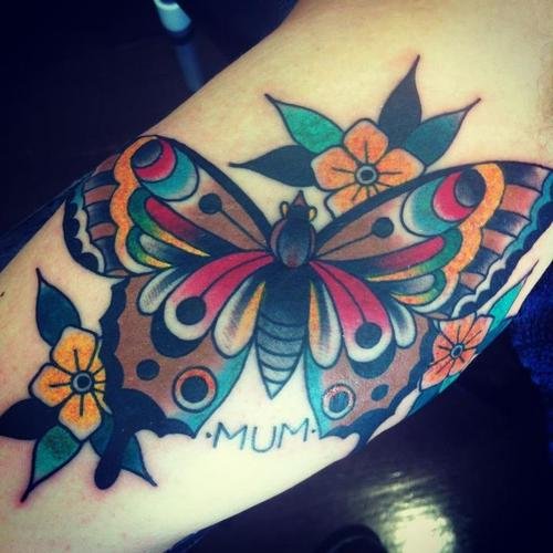Yellow Flowers And Moth Colored Ink Tattoo