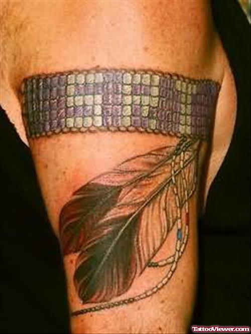 Feathers Tattoo On Muscle