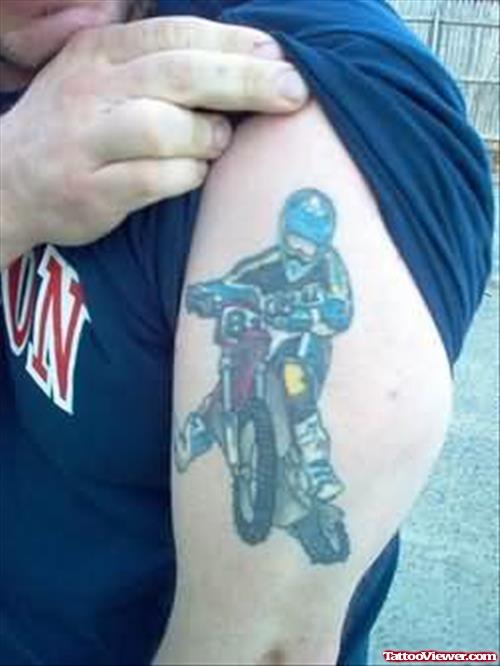 Likeable Bike Rider Tattoo On Muscle