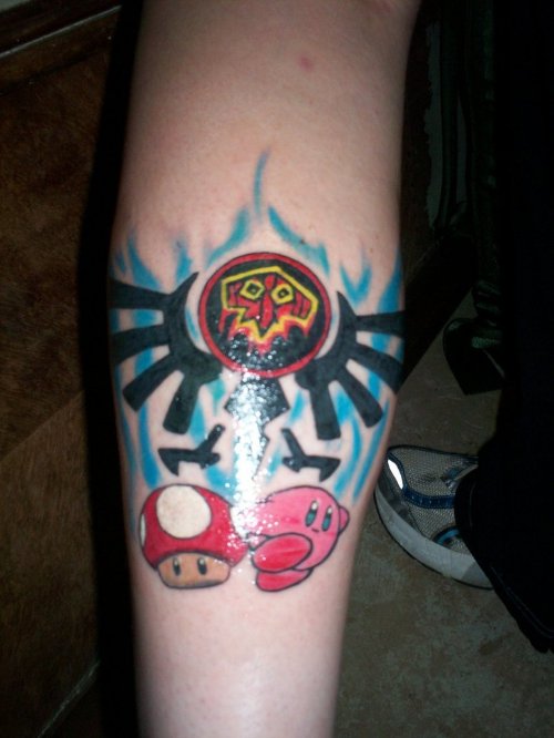 Zelda Crest And Mario Mushroom Tattoo On Leg
