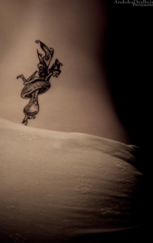 Grey Ink Fairy And Mushroom Tattoo On Lowerback