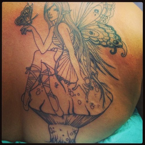 Outline Fairy Girl Sitting on Mushroom Tattoo On Back